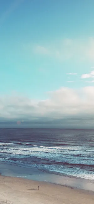 Enjoy A Tranquil Moment With The Beautiful Ocean. Wallpaper