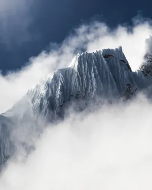 Enjoy Nature's Beauty With A View Of A Mountain Down To The Coast Wallpaper