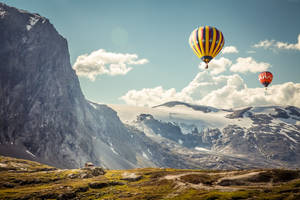 Enjoy The Beautiful Landscape Of The World From A Hot Air Balloon. Wallpaper