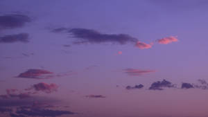 Enjoy The Dreamy Pastel Shades Of The Ombre Cloudy Purple Sky Wallpaper
