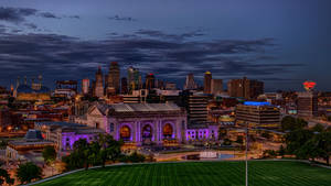 Enjoy The Stunning Night Sky Over Kansas City Wallpaper