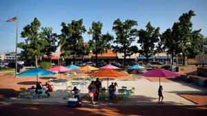 Enjoying The Sunlight In Downtown Garland Square Wallpaper