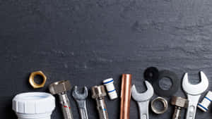 Essential Plumbing Tools Ready For Service Wallpaper