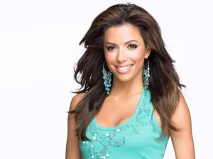 Eva Longoria Striking A Pose In An Elegant Outfit. Wallpaper