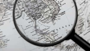 Examination Of Details - Magnifying Glass On Black And White Map Wallpaper