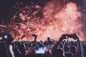 Excited Crowd At A Music Festival Wallpaper