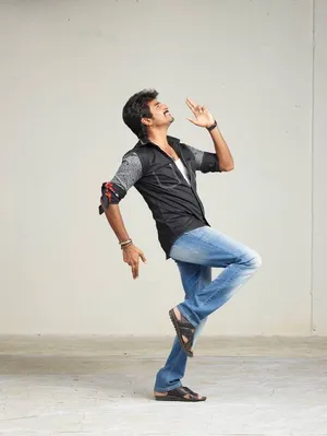 Exciting Action Shot Of Sivakarthikeyan Running Wallpaper