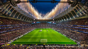 Exciting Nightfall At Tottenham Stadium Wallpaper