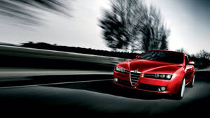 Experience The Thrilling Performance Of The Alfa Romeo 159 Wallpaper