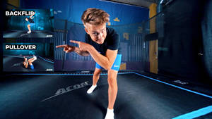 Experienced Trampoline Trainer Offering Instruction Wallpaper