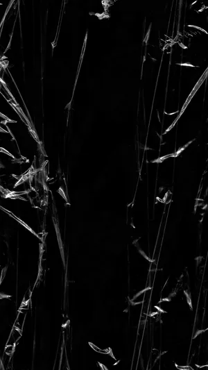 Explore The Strange And Surreal With This Black Plastic Figure. Wallpaper