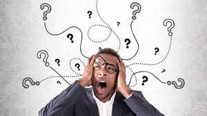 Expressive African Man Displaying A Confused Expression Wallpaper