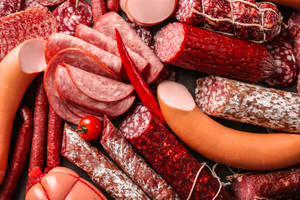 Exquisite Assortment Of Cold Meats Up Close Wallpaper