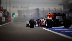 F1 Racing Car In The Track Wallpaper