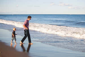 Father And Male Child Walking In Bare Feet Wallpaper