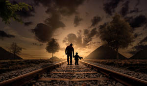 Father And Son Walking On Railroad Tracks Wallpaper