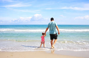 Father Daughter On Vacation Wallpaper