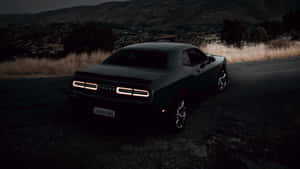 Feel The Thrill Of The Open Road In A Dodge Challenger Wallpaper
