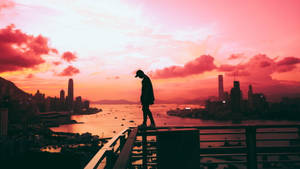 Feeling Alone Walking On Ledge Wallpaper