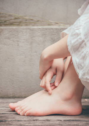 Feet And Hands On Grey Wall Wallpaper