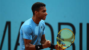 Felix Auger-aliassime In An Ecstatic Fist Pump Celebration Wallpaper