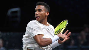 Felix Auger Aliassime Swinging Wallpaper