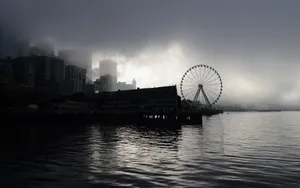 Ferris Wheel Under Gloomy Sky Wallpaper
