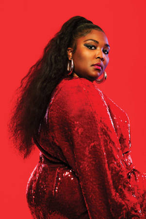 Fierce Lizzo In Sequined Red Dress Wallpaper