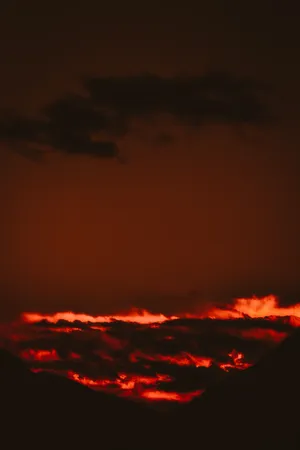 Fiery Red Clouds In Red Orange Sunset Wallpaper