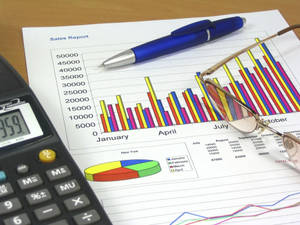 Finance Graph Report On Table Wallpaper