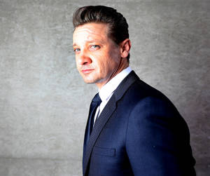 Fine Looking Jeremy Renner In Suit Wallpaper