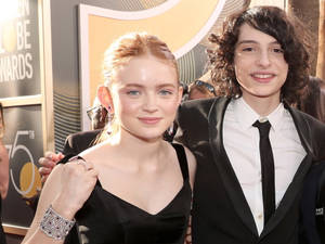 Finn Wolfhard With Co-star Wallpaper