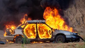 Fire Fighters Bravely Using Their Fire Cars To Put Out A Fire Wallpaper