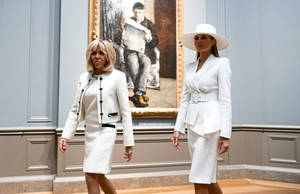 First Ladies United: Melania Trump With Brigitte Macron Wallpaper