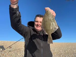 Fisherman Holding Caught Dab Fish Wallpaper