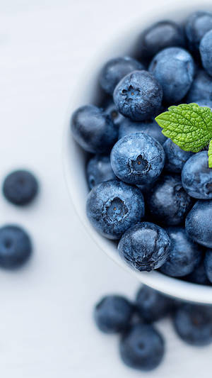 Flat Lay Of Blueberries Bowl Wallpaper