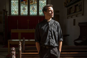 Fleabag And The Priest Sharing A Moment In Church Wallpaper