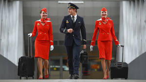 Flight Attendants With Pilot Wallpaper