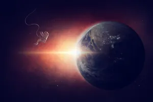 Floating Astronaut Observing Earth Wallpaper