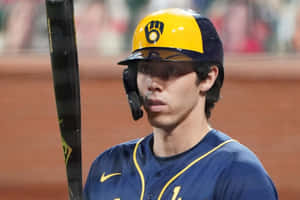 Focused Baseball Player With Bat Wallpaper