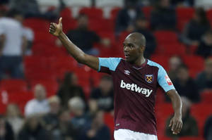 Footballer Giving Thumbs Up During Match Wallpaper