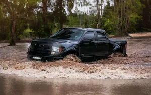 Ford Raptor Crossing A Muddy Flood Wallpaper