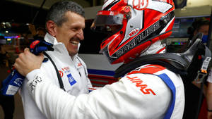 Formula One Driver, Kevin Magnussen Preparing For A Welcoming Hug With His Team Principal, Gunther Steiner. Wallpaper