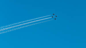 Four Fighter Jets In Plain Blue Wallpaper
