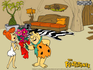 Fred Flintstone Offers Flowers To Wilma Wallpaper