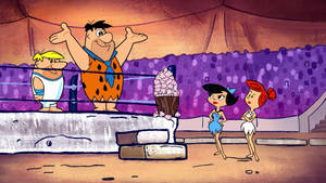Fred Flintstone Stone Age Smackdown Scene Wallpaper