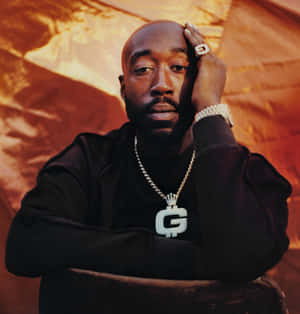Freddie Gibbs Portraitwith Gold Chain Wallpaper