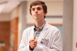 Freddie Highmore In Doctor Suit Wallpaper