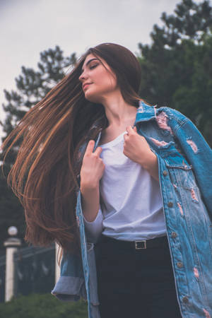 Free-spirited Young Girl Embracing Nature Wallpaper
