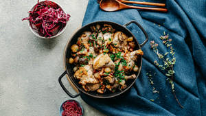 French Stew Coq Au Vin And Shredded Purple Cabbage Wallpaper